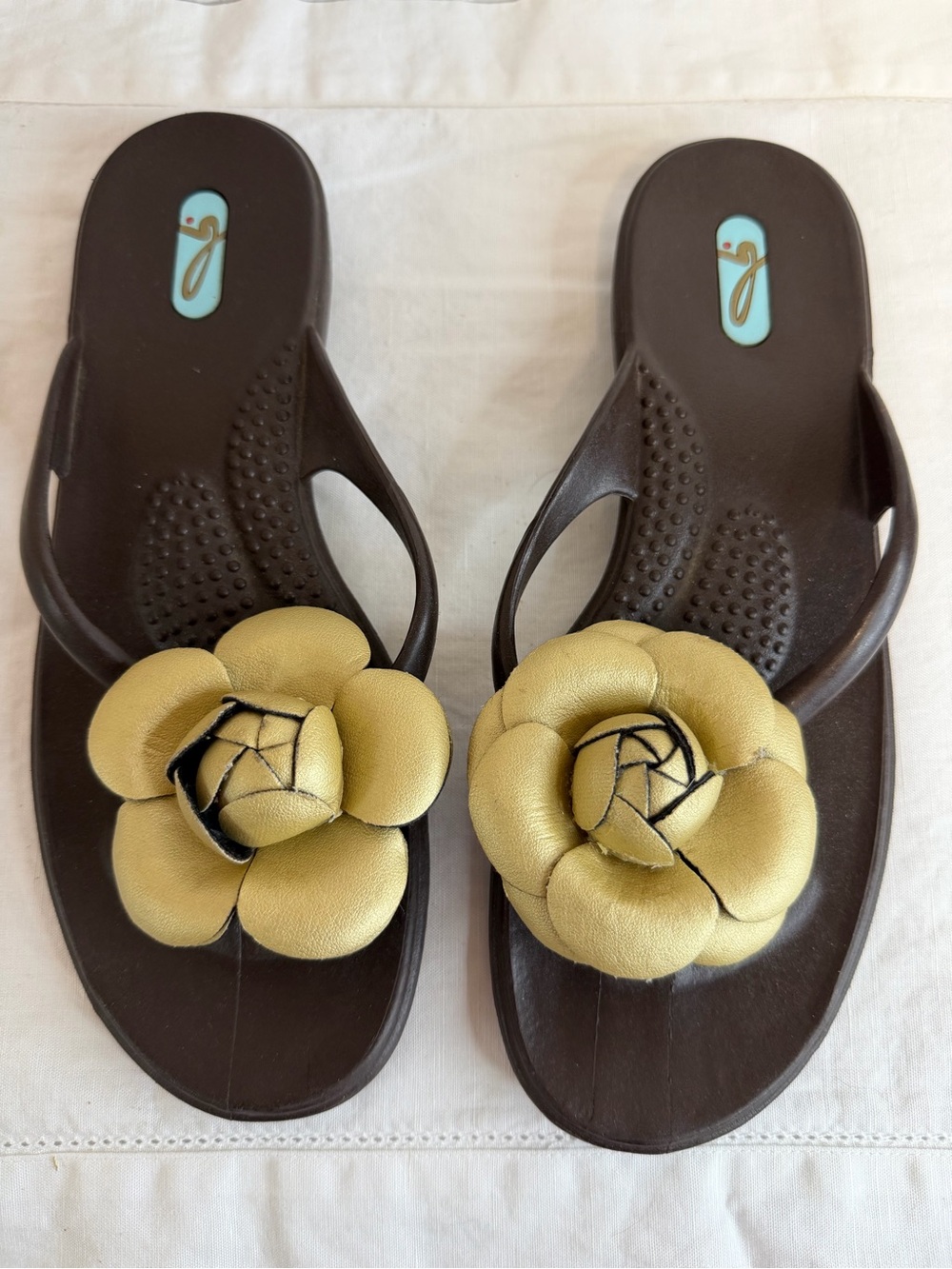 OKA b. Brown Flip Flop Sandals with Gold Leather Flower